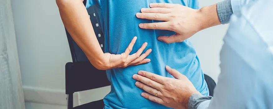 Chiropractor in Nashua providing back pain relief with spinal decompression shockwave therapy and Class IV laser treatment