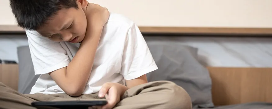 Child wearing a properly fitted backpack to support healthy back-to-school posture