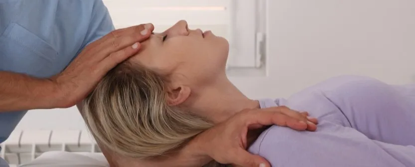 Chiropractor performing spinal adjustment on patient in Nashua NH