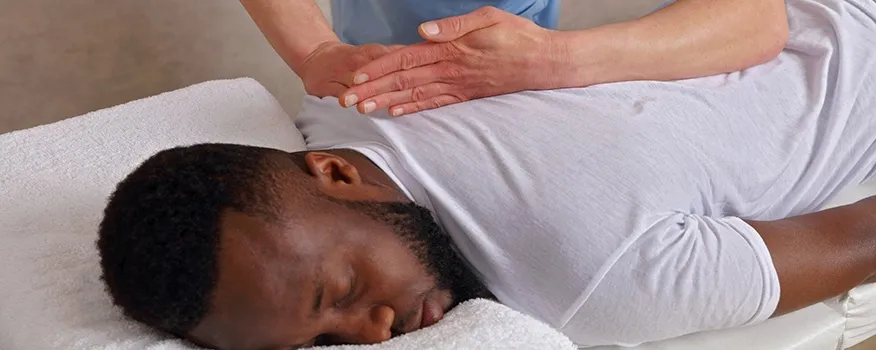 Chiropractor treating patient for pinched nerve relief at Main Street Wellness in Nashua